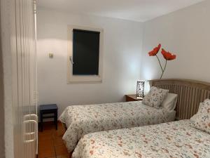 A bed or beds in a room at Can Ramon casa con garaje