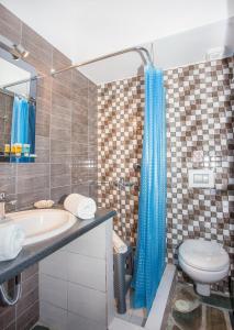 a bathroom with a sink and a toilet and a shower at 3SSS Bouquet Studios SEA in Marmarion