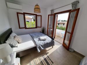 Posteľ alebo postele v izbe v ubytovaní Yvi´s Greek House