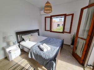 Posteľ alebo postele v izbe v ubytovaní Yvi´s Greek House
