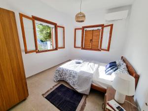 Posteľ alebo postele v izbe v ubytovaní Yvi´s Greek House
