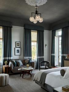 a bedroom with a bed and a living room at The Madrona in Healdsburg