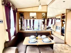 a dining room with a table in a train car at The Windermere in Whitstable