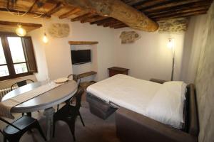 En eller flere senger på et rom på casa vacanze Castiglione - 4 posti letto