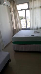 A bed or beds in a room at Temporada