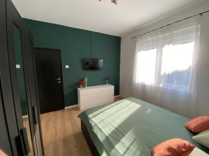 Krevet ili kreveti u jedinici u okviru objekta Green Oasis New Apartment