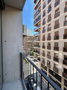 a balcony with a view of a building at Reyes Católicos Premium Homes in Alicante