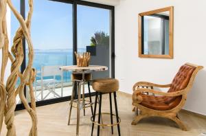 a room with a table and a chair and a window at Gallery Luxury Suites & Rooms-Only Adults in Split