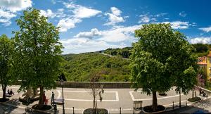 a view of a park with trees and a road at Bed&Breakfast Kvarner in Labin