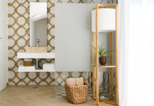 a bathroom with a mirror and a chair at Gallery Luxury Suites & Rooms-Only Adults in Split