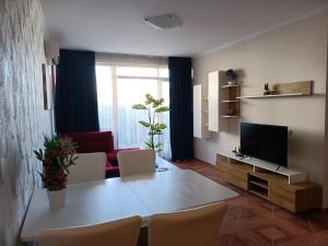 A television and/or entertainment centre at Sun Wave EXCLUSIVE