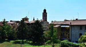 an old building with a clock tower in the background at Veronauptoyou Apartments in Verona