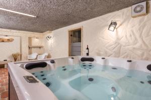 a jacuzzi tub in a room at Mountain house Beauty of Laz in Ravna Gora