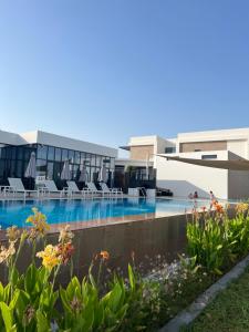 a view of the pool at the resort at Relaxing villa with access to pool and beach in Ras al Khaimah