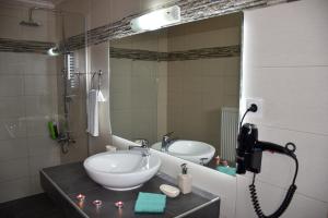 a bathroom with a sink and a mirror at Madares Apartments Anopolis in Anopoli Sfakion