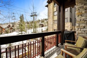 a balcony with a chair and a view of the mountains at Arrowleaf Lodge - 3 Bed Condo #302 in Park City