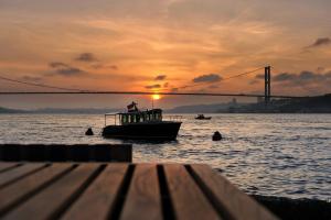 a man on a boat on a body of water at Sumahan - on the Water in Istanbul