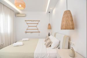 A bed or beds in a room at Naxos Blue Sky