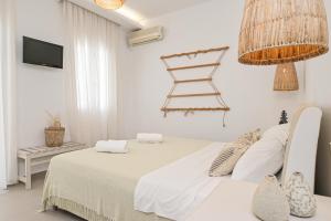 A bed or beds in a room at Naxos Blue Sky