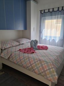 Posteľ alebo postele v izbe v ubytovaní Apartmani Rudi
