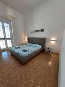 a bedroom with a large bed in a room at Dimora Trinity in Polignano a Mare