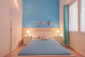 Posteľ alebo postele v izbe v ubytovaní Approdo Rooms - Eja Sardinia