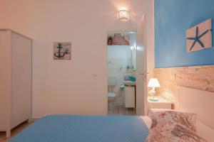 Posteľ alebo postele v izbe v ubytovaní Approdo Rooms - Eja Sardinia