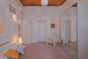 Posteľ alebo postele v izbe v ubytovaní Approdo Rooms - Eja Sardinia