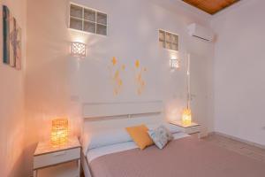 Posteľ alebo postele v izbe v ubytovaní Approdo Rooms - Eja Sardinia