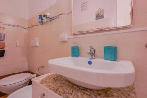 Kúpeľňa v ubytovaní Approdo Rooms - Eja Sardinia