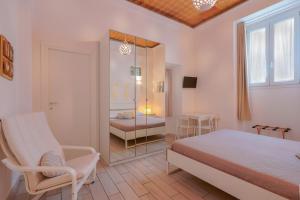 Posteľ alebo postele v izbe v ubytovaní Approdo Rooms - Eja Sardinia