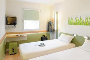 Postel nebo postele na pokoji v ubytování Ibis Budget Montelimar