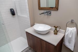 a bathroom with a sink and a shower at Loft Argentino Apart Buenos Aires in Buenos Aires +65 photos