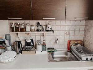 a kitchen with a sink and a counter top at Elena Rista Studios in Parga +192 photos