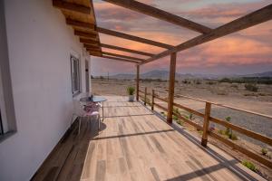 a porch of a house with a view of the desert at Los Olivos in Cardón