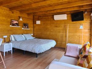 A bed or beds in a room at Casa Abuelo Yano