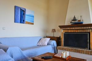 Et opholdsområde på Pavlos' cottage with beach view