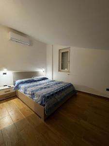 Katil atau katil-katil dalam bilik di Terrazze Marinella - Appartamenti - Case vacanze