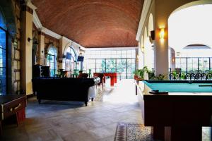 a lobby with a pool table in a room at Hacienda San Patricio in San Miguel de Allende