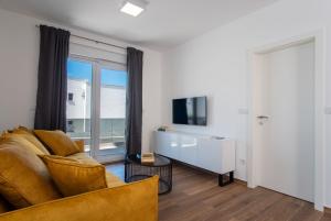 Televiisor ja/või meelelahutuskeskus majutusasutuses Apartment Mia Šimuni