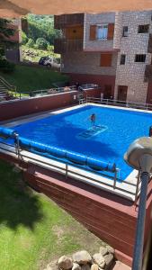 a person swimming in a large swimming pool at LUA in Vielha