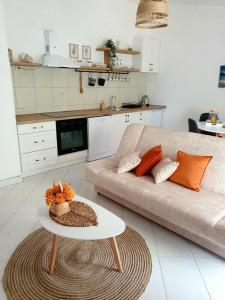 a living room with a couch and a table at Apartment Macic Dub II in Kotor