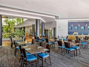 Restaurant ou autre lieu de restauration dans l'établissement Novotel Darwin CBD
