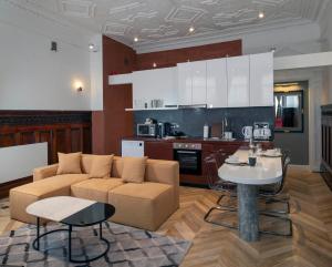 a living room with a couch and a table at Trueman Court Luxury Serviced Apartments in Liverpool