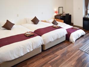 Postel nebo postele na pokoji v ubytování LiVEMAX RESORT Jogasaki Kaigan
