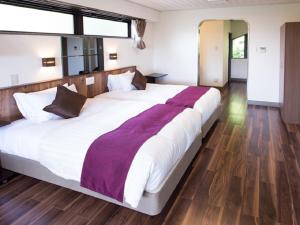 Postel nebo postele na pokoji v ubytování LiVEMAX RESORT Jogasaki Kaigan