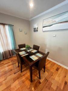 a dining room with a wooden table and chairs at Atlanta Unit 2 Room 3 - Private Bedroom with Private Bathroom in Atlanta