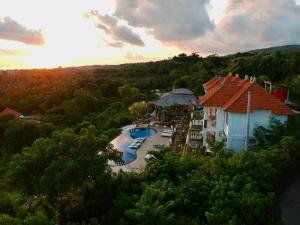 an aerial view of a resort with a swimming pool at The Kama in Nusa Penida