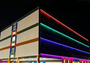 a building with colorful signs on the side of it at Philly Inn & Suites in Philadelphia