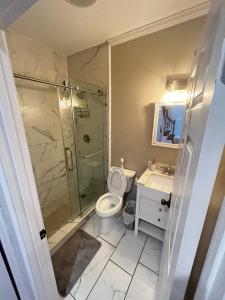 a bathroom with a shower and a toilet and a sink at Atlanta Unit 2 Room 3 - Atlanta Bests Kept Secret Private Bedroom & Bathroom in Atlanta +6 photos